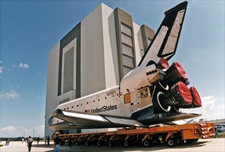 Space Shuttle Columbia rolls over from Orbiter Processing Facility bay 1 to the Vehicle Assembly Building to be mated to its external tank/solid rocket booster stack ca. 1997