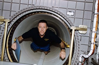 Candid views of STS-81 Cmdr Baker in Spacehab module