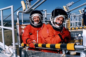 STS-82 Mission Commander Kenneth D. Bowersox, at right, and Pilot Scott J. "Doc" Horowitz practice emergency egress procedures in a slidewire basket at Launch Pad 39A