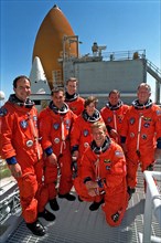 STS-86 crew members pose for a group photograph at Launch Pad 39A ca. 1997