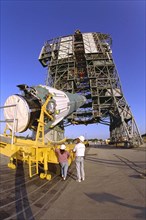 The first stage of the Delta II rocket which will to be used to launch the Advanced Composition Explorer (ACE) spacecraft is erected at Launch Complex 17A at Cape Canaveral Air Station ca. 1997
