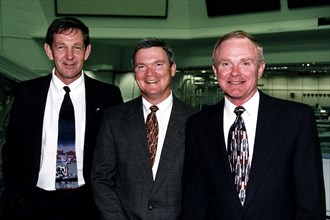 Roy D. Bridges Jr., KSC's next center director, at right, poses in the firing room of the Launch Control Center with two top contractor officials, L to R Michael McCulley and Bruce Melnick ca. 1997