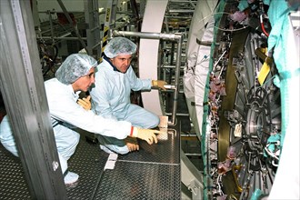 Mission Specialist Nancy Currie and Commander Bob Cabana participate in the Crew Equipment Interface Test (CEIT) for STS-88 in KSC's Space Station Processing Facility ca. 1997