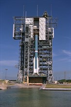 The solid rocket motors of the Delta II rocket which will to be used to launch the Advanced Composition Explorer (ACE) spacecraft are erected at Launch Complex 17A at Cape Canaveral Air Station ca. 19...