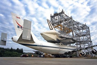 The Space Shuttle Atlantis sits atop the Shuttle Carrier Aircraft at Kennedy Space Center’s Shuttle Landing Facility ca. 1997