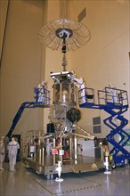 The propulsion system is mated to the Lower Equipment Module of the Cassini spacecraft in the Payload Hazardous Servicing Facility (PHSF) ca. 1997