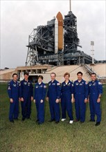 STS-84 crew members pose for a group photograph at Launch Pad 39A ca. 1997