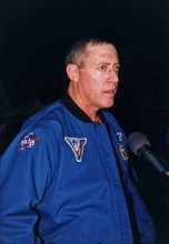 STS-81 Mission Commander Michael A. Baker talks to the press at the KSC Shuttle Landing Facility after he and his crew arrived at the space center for the final countdown preparations for the fifth Sh...