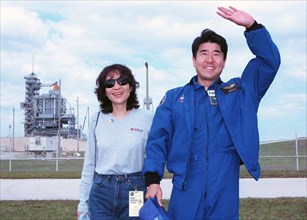 STS-87 Mission Specialist Takao Doi, Ph.D., of the National Space Development Agency of Japan poses with his wife, Hitomi Doi ca. 1997