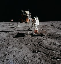 (20 July 1969) --- The deployment of the Early Apollo Scientific Experiments Package (EASEP) is photographed by astronaut Neil A. Armstrong, Apollo 11 commander, during the crew extravehicular activit...