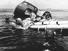 (21 July 1965) --- Prime crew for the Gemini-Titan 5 (GT-5) spaceflight, astronauts Charles Conrad Jr. (in water) and L. Gordon Cooper Jr. (in raft) practice survival techniques