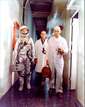 (1962) --- Astronaut John H. Glenn, Jr., Dr. William Douglas, astronauts Flight Surgeon, and equipment specialist Joe Schmitt leave crew quarters prior to Mercury-Atlas 6 (MA-6) mission