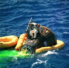 (091566) - Astronaut Charles Conrad Jr., command pilot of the Gemini 11 space mission, climbs from the spacecraft minutes after splashdown