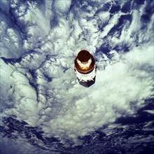 1991 - The free-flying Tracking and Data Relay Satellite-E (TDRS-E), still attached to an Inertial Upper Stage (IUS), was photographed by one of the crewmembers during the STS-43 mission.