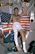 1992 -  This photograph shows Astronaut Larry De Lucas wearing a stocking plethysmograph during the mission.