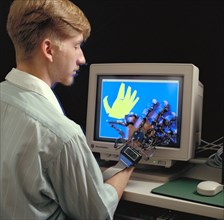 1992 - Virtual Environment Telepresence workstation, simulated Mars Exploration shows William Briggs with EXOS Dexterous interface (virtual hand)