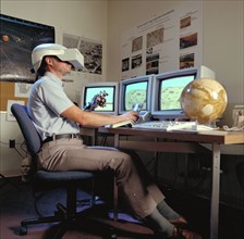 1992 - Virtual Environment Telepresence workstation, simulated Mars Exploration shows Lewis Hitchner with virtual helmet and EXOS Dexterous interface (virtual hand)
