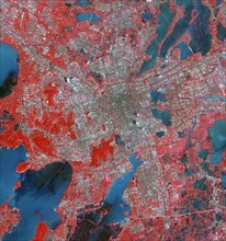 The Landsat TM image was acquired August 4, 1984, and the Aster image was acquired August 2, 2015. The images cover an area of 48 by 53 km, and are located at 31.2 degrees north, 120.4 degrees east.