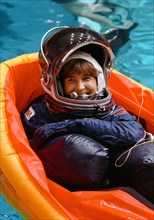 1990 - STS-37 Mission Specialist (MS) Godwin floating in life raft in JSC WETF pool
