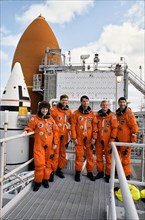 (15 Dec 1992) --- Astronauts assigned to fly aboard Endeavour pose near the Shuttle during a break in countdown demonstration tests