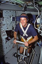 (2-11 Aug 1991) --- Astronaut G. David Low, STS-43 mission specialist, works out on a treadmill device which was used for medical testing on the nine-day flight.