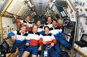 1992 - STS-47 crew poses for official onboard (in space) portrait in SLJ module