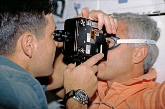 1992 - Crewmembers in the middeck with the Retinal Photography experiment