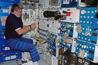 Crewmember activity in the shuttle middeck