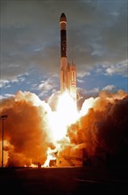 1998 - A Boeing Delta II (7326) rocket hurls Deep Space 1 through the morning clouds after liftoff, creating sun-challenging light with its exhaust, from Launch Complex 17A, Cape Canaveral Air Station...