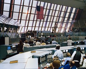 1990 - At the conclusion of another successful countdown, members of the KSC launch team in Firing Room 1 rivet their eyes on the skies to the east of the Launch Control Center. Their reward was a gli...