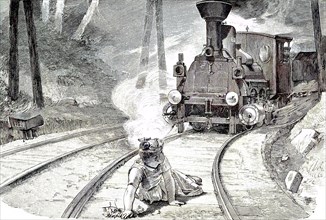 child plays on the railway tracks and is in danger. Kind spielt auf den Bahngleisen und ist in Gefahr