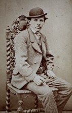 Photo of a man with suit and bowler hat