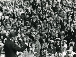 President John F. Kennedy exchanges greetings with the crowd