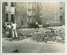 Playing catch outside tenement buildings