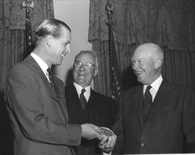 President Eisenhower gives medal to Prince Philip