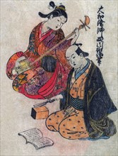 Young Lady taking a lesson on a Shamisen