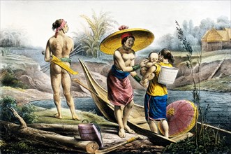 Dyak woman and canoe