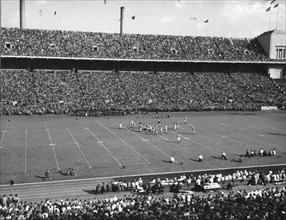 Sixty-three thousand football fans attended the annual game between Ohio State University and the University of Iowa. Columbus, Ohio, 1948.