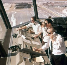 Air traffic controllers at work at Dulles Airport. Chantilly, VA, circa 1968.