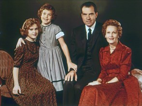 The Richard M. Nixon family in 1960. From left to right: Daughters Tricia and Julie, Vice-President Richard Nixon and wife Pat Nixon. 1960.