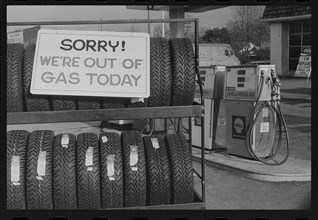 A sign outside a Shell gas station informs customers that "We're Out of Gas Today," Washington, DC. 1/29/1974.