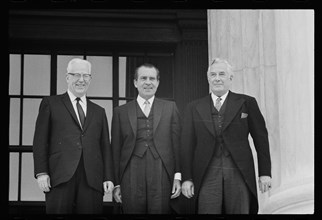 New Chief Justice of the Supreme Court Warren E. Burger (far right) standing with (from l-r) former Chief Justice Earl Warren and President Richard M. Nixon, Washington, DC, 6/23/69)