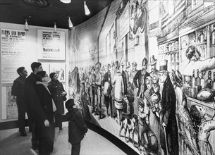 Immigrants View Museum Exhibit