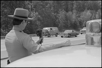 Officer Using Radar Speed Gun