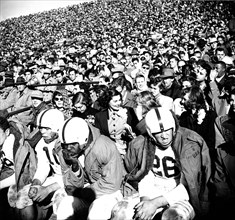 May 1950 - View of Football Crowd and Players on Bench During Game