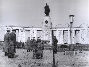 March 19, 1963 - Soviet Air Force Officers Visiting a Soldier's Memorial Under Guard from British