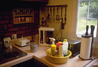 May 6, 1996 - Kitchen counter with cleaning supplies in a bucket