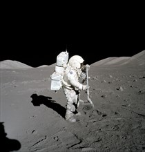 Astronaut Harrison Schmitt collects lunar rake samples during EVA