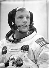 Dunned in his space suit, mission commander Neil A. Armstrong