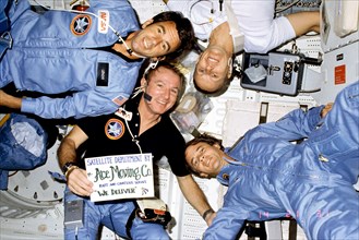 Four STS-5 astronaut crew members